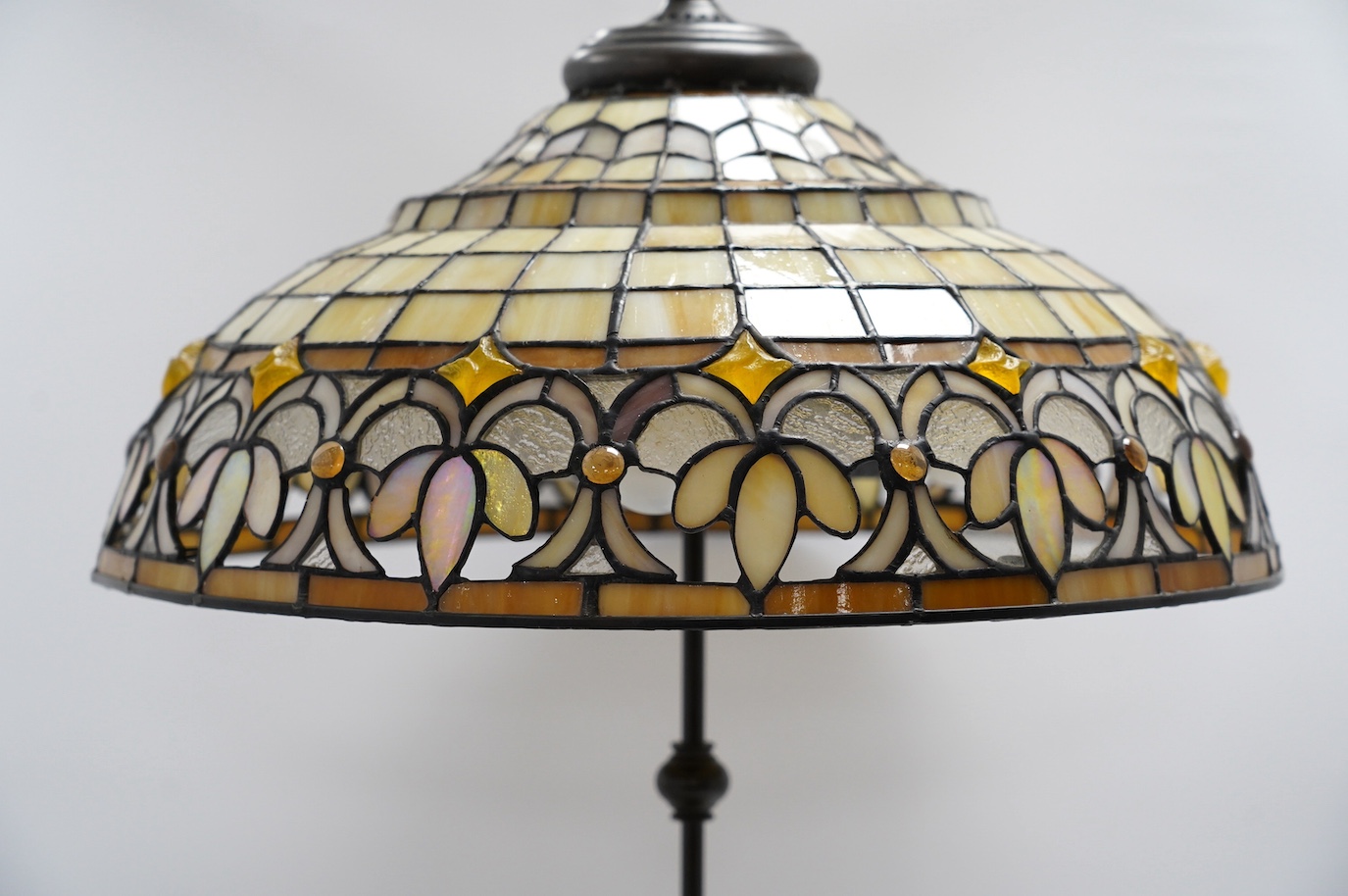 A Tiffany style coloured glass ceiling shade with pendant chains, 63cm high overall. Condition - fair to good.